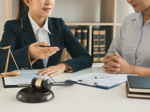 Legal consultation with gavel and documents, discussing real estate matters.
